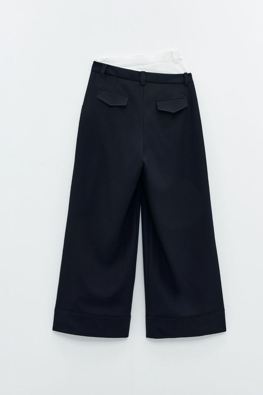 Pantaloni a vita alta combinato a contrasto. Eleh