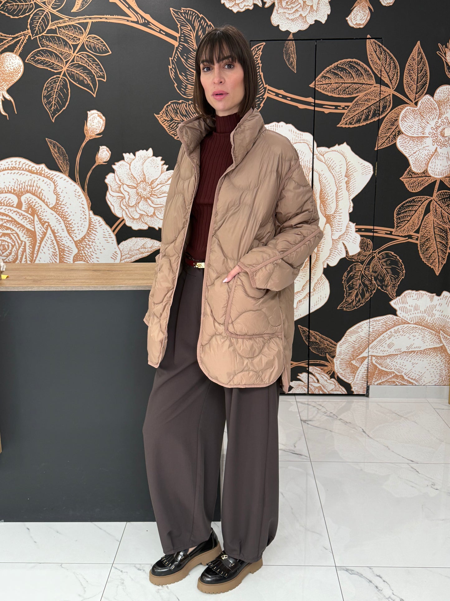 Piumino midi con impunture beige