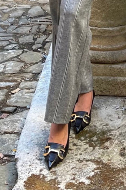 Decollete in pelle con morsetto e frange