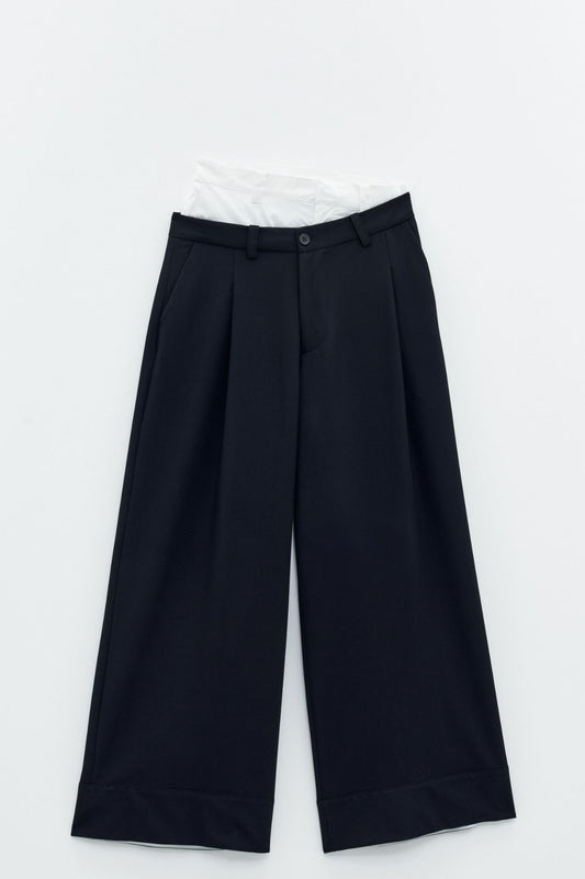 Pantaloni a vita alta combinato a contrasto.   Eleh