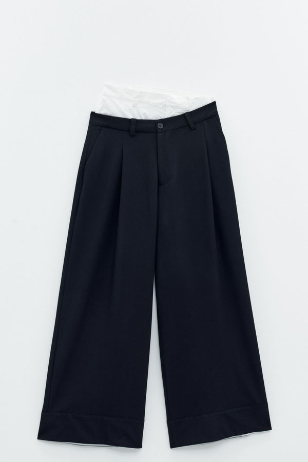 Pantaloni a vita alta combinato a contrasto.   Eleh